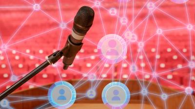 Picture of a microphone and podium, with a network of small portraits connected together.