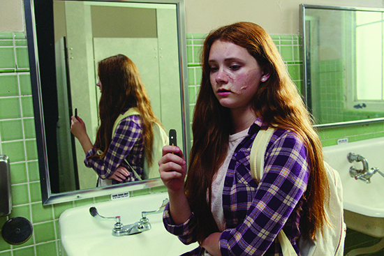 Girl vaping in school bathroom mirror 