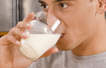 young man drinking glass of milk (350x224)