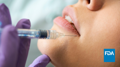 A woman getting an injection near her lips.