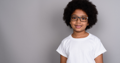 Standing girl wearing glasses