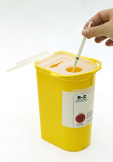 yellow sharps disposal container