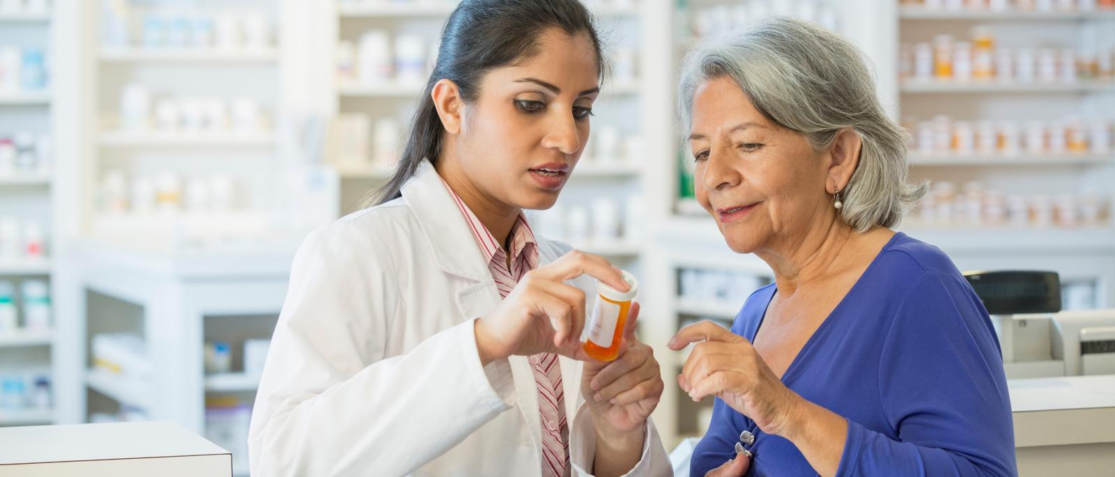 Pharmacist talking to customer