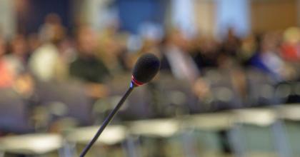 Microphone on podium before webinar audience