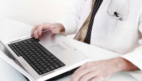 Doctor working on laptop