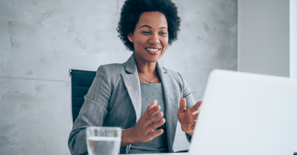 Woman seated in front of laptop