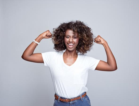 African American Woman Wearing White T-Shirt in Power Stance