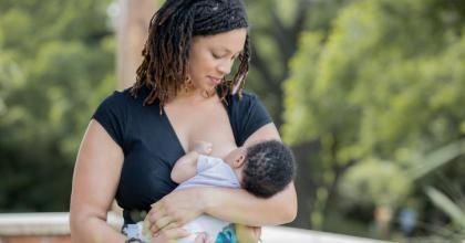 woman breastfeeding outdoors