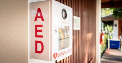 Automated External Defibrillator (AED) placed on the wall in a public location.