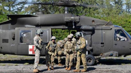 Combat medics conduct an exercise at the Marine Corps Training Area Bellows, Hawaii, on Jan. 10, 2018. (U.S. Army photo by Staff Sgt. Armando R. Limon, 3rd Brigade Combat Team, 25th Infantry Division)