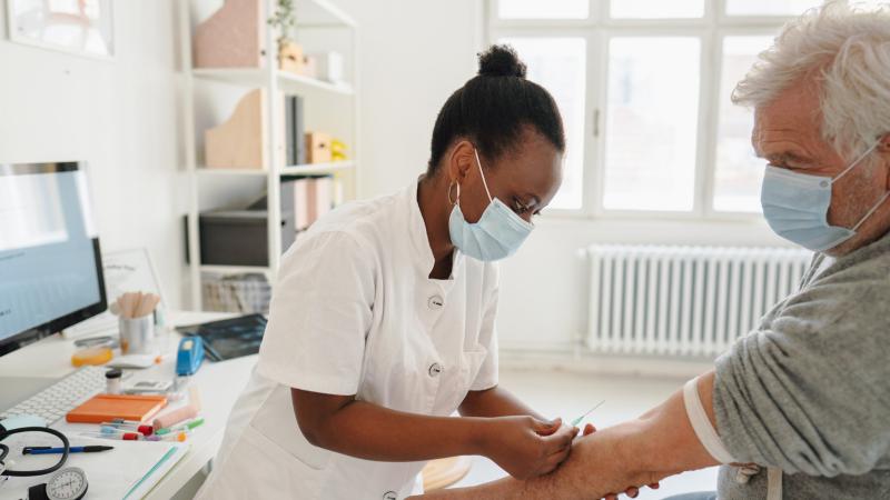 Image of a doctor administering a test