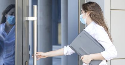 Woman opening a door