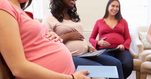 Pregnant women holding their bellies