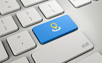 Close up of computer keyboard w/ location symbol on a key – Getty Image