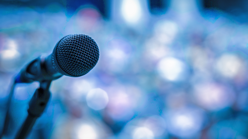 photo of a microphone against a blurry background