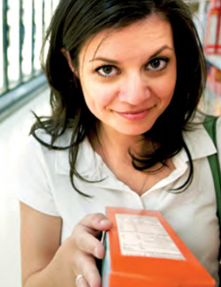 woman looks at ingredients on food package