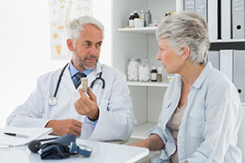 physician speaking to a woman