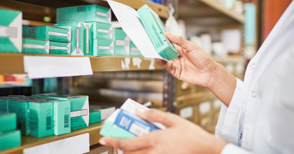 Pharmacist checking medicine boxes on a shelf, representing expiration date extension. In some cases, testing has shown that certain properly stored medical products can be used beyond their labeled expiration date if they retain their stability.  