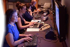 Telephone and chat messages screeners during a live broadcast.