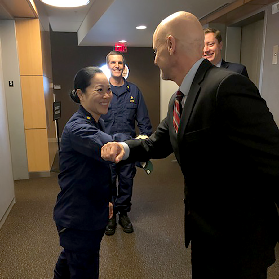 Dr. Hahn, bumping elbows with Commissioned Corps officer during early stages of the coronavirus pandemic