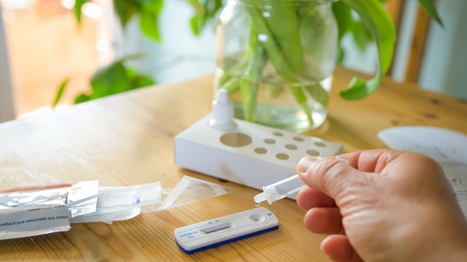 A person using a COVID rapid test.