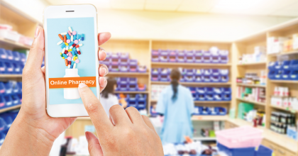 Person using a cell phone in a pharmacy