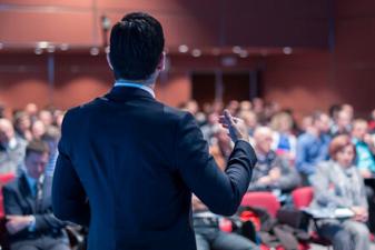 A person standing in front of a crowd