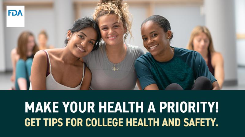 Three college women smiling at the camera