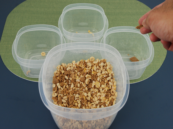 Crushed cereal being sorted back into their original bowls