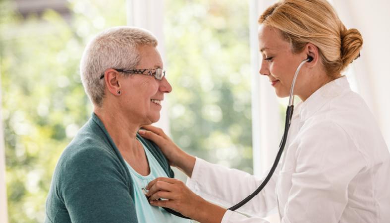 HCP with stethoscope on patient's chest