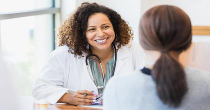 Caring doctor listening to patient