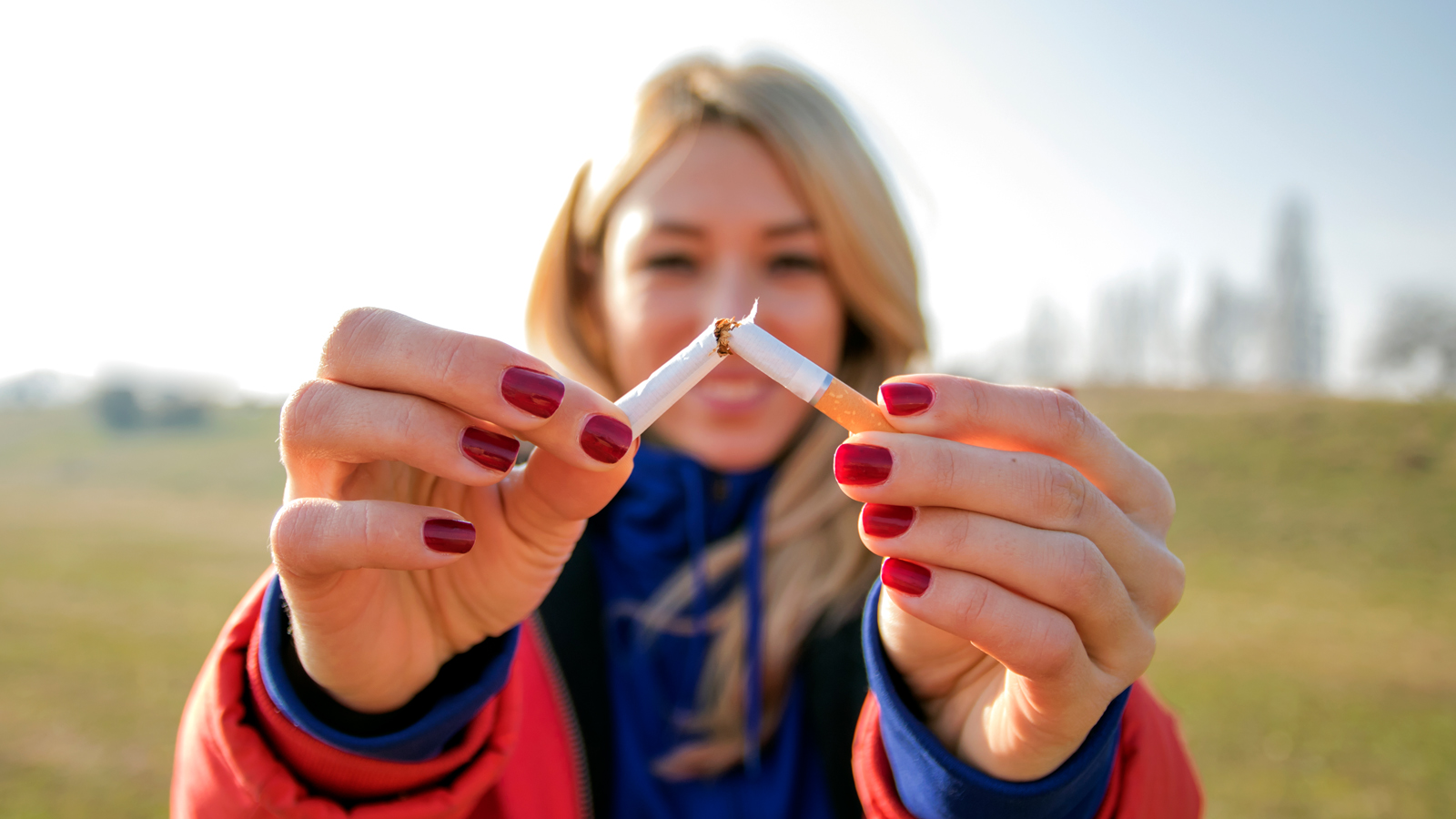 Woman breaking a cigarette