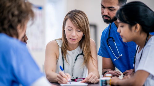 Image of a group of medical professionals having a meeting.