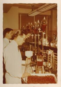 color photograph of scientists in laboratory testing cranberries