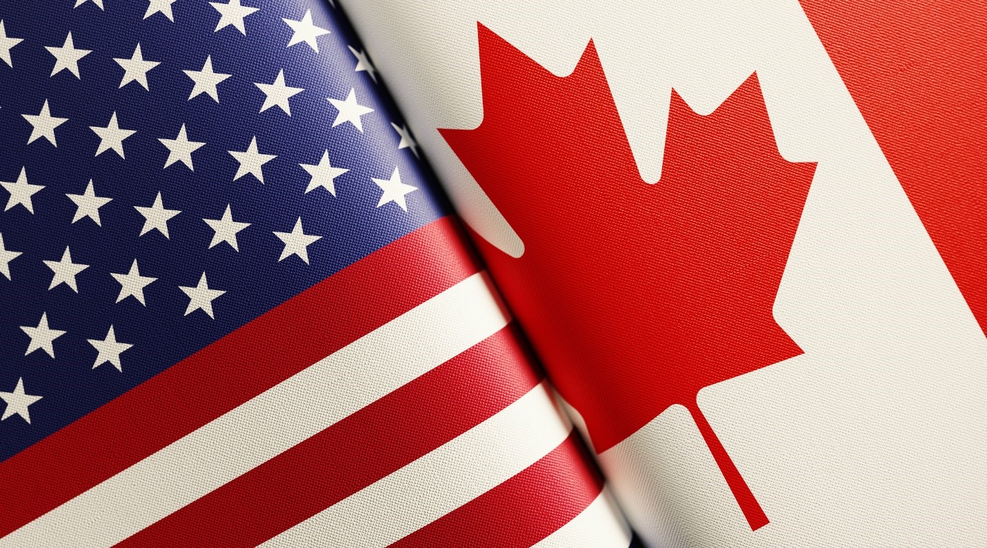 United States and Canadian flags together.