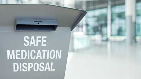 Drug drop off box with term "Safe Mediation Disposal" printed on it