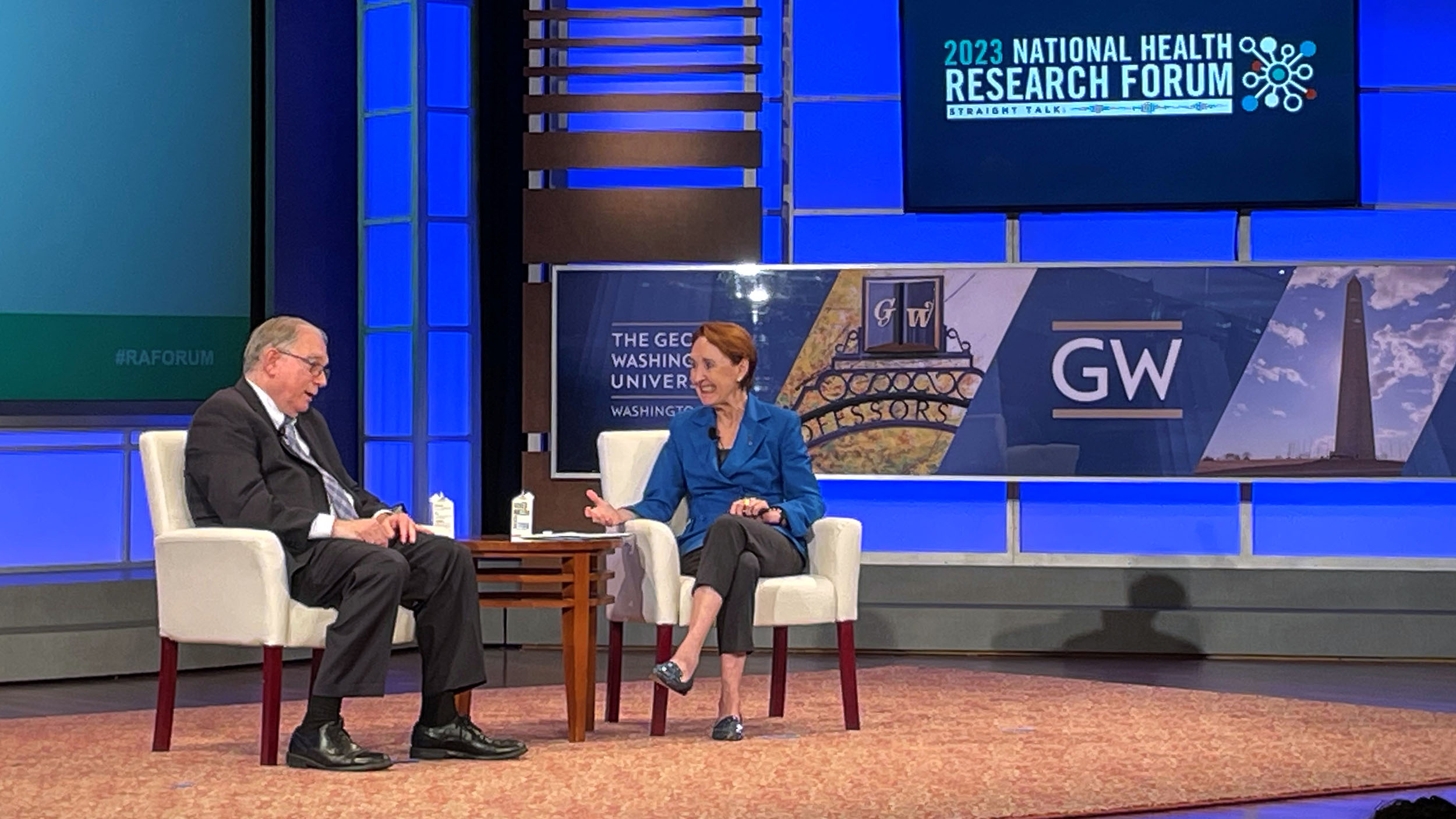 Lawrence Tabak talks with Mary Woolley on stage at the 2023 National Health Research Forum at George Washington University